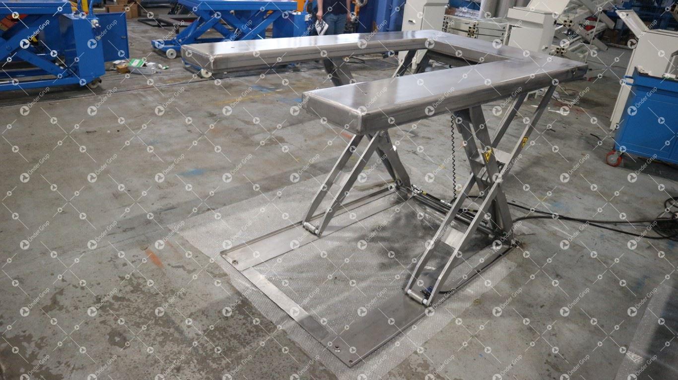 Scissor lift table - ADE-WERK - hydraulic / stationary / U-shape